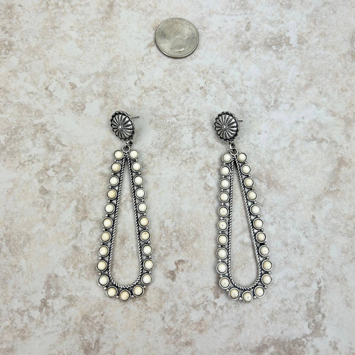 Silver sunburst concho with white stone long teardrop Earring