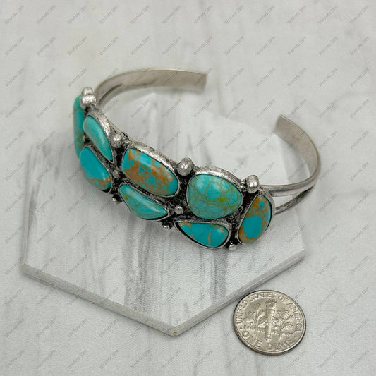 Silver metal with blue turquoise stone bangle